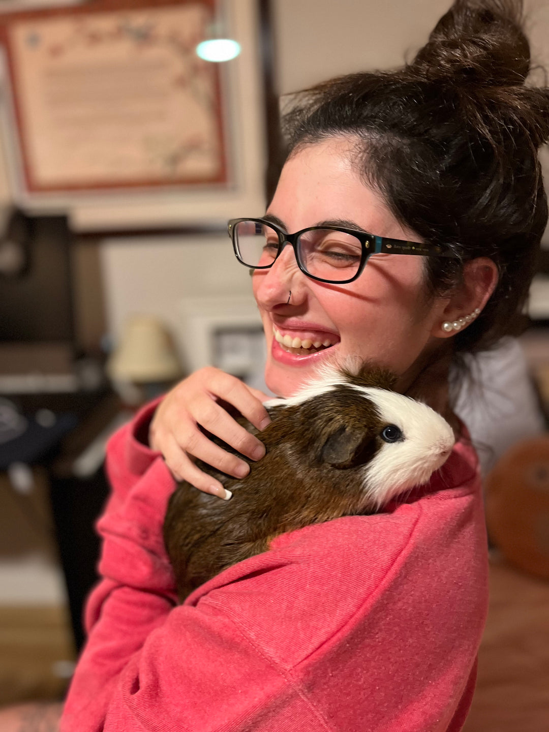 Girl bonding with new guinea pig