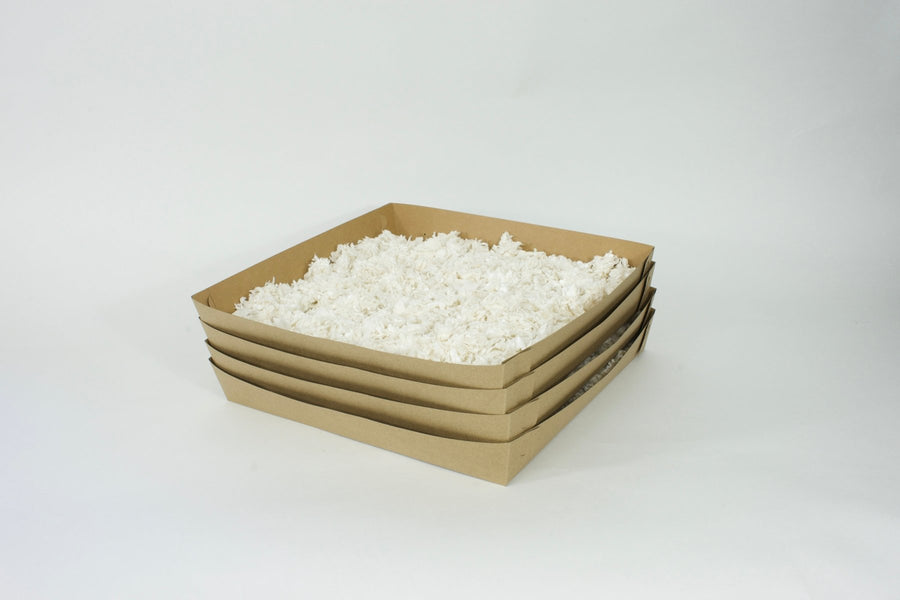 Guinea Colony Pre - Filled Disposable Kitchen Liner Refills with Paper Bedding (4 - Pack) - Critter Colony Club - Stack of kitchen liners filled with white paper bedding. Perfect for guinea pig cleaning of a kitchen in a guinea pig cage.